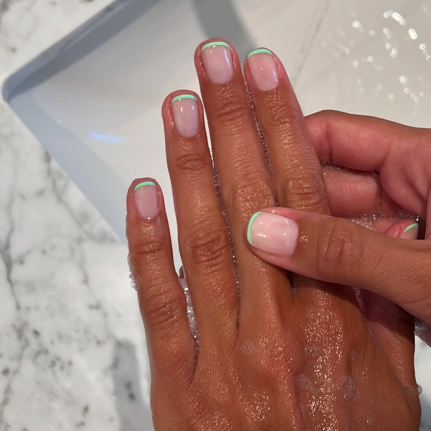 Bright green French manicure