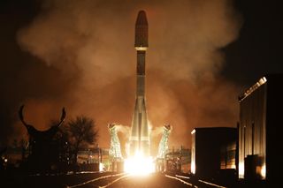 An Arianespace Soyuz rocket launches 36 OneWeb internet satellites into orbit from the Baikonur Cosmodrome in Kazakhstan on Dec. 27, 2021. OneWeb has halted launches from Baikonur in the wake of Russia's invasion of Ukraine and demands that Russia placed on a OneWeb mission scheduled to launch on March 4, 2022.