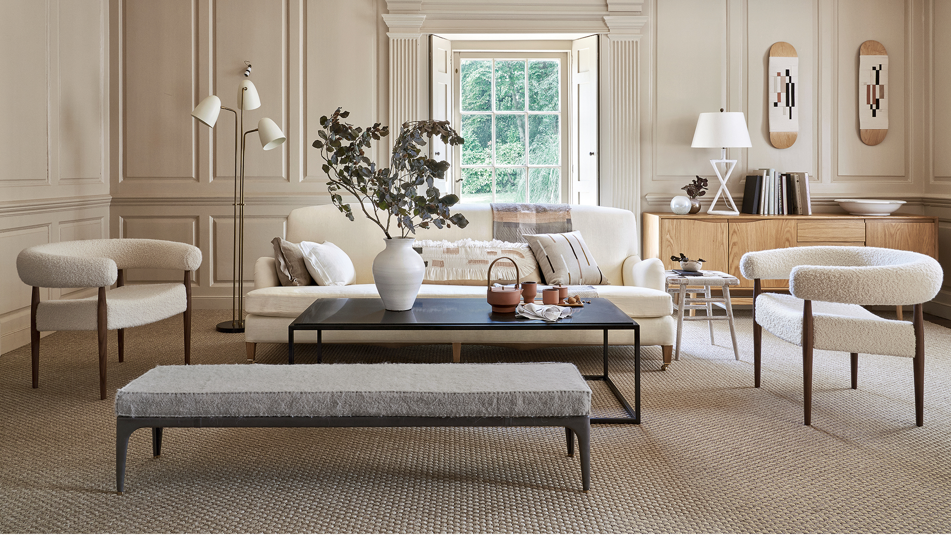 neutral modern country style living room with round boucle chairs