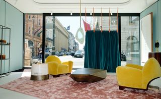 Tato armchairs in living room with street view
