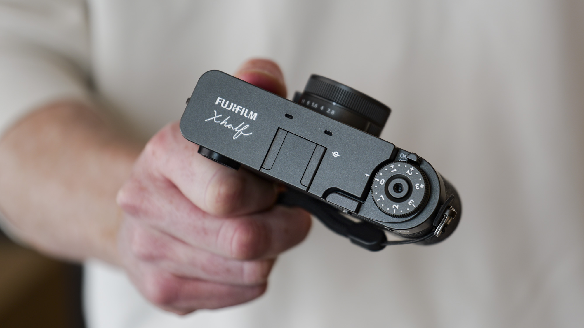 Fujifilm X half compact camera in the hand