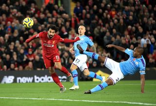 Mohamed Salah, left, scores Liverpool’s second