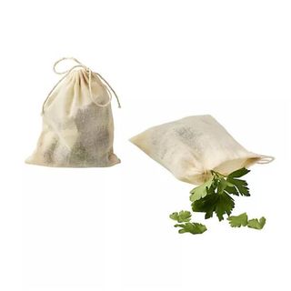 Two bouquet bags on a white background, one has herbs spilling out of it