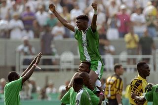 Nwankwo Kanu is carried by his team-mates after Nigeria's win over Argentina in the final of the football tournament at the 1996 Olympics in Atlanta.