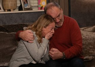 Nicola King sobs as Bob King comforts her.