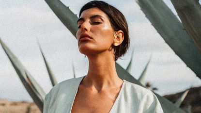 Image of a woman in a meditative state with her head facing the sky