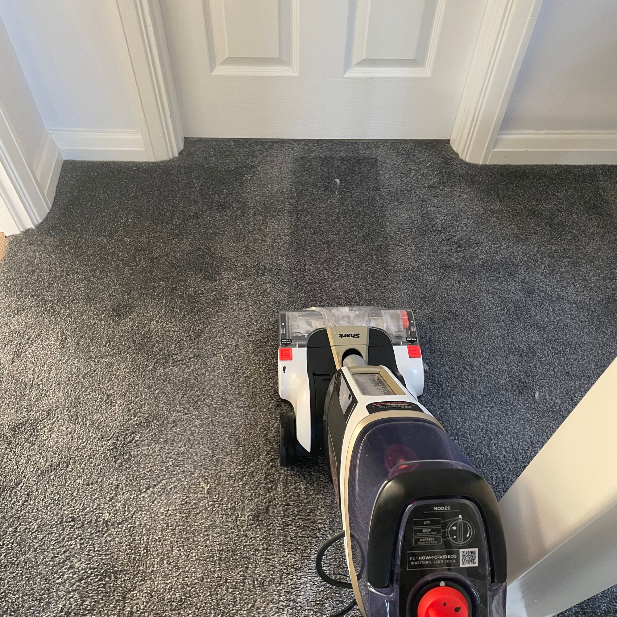 Shark CarpetForce Upright Carpet Cleaner cleaning dark grey carpets