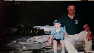 an old disposable camera photo of Anthony Templet with his dad Burt Templet