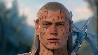 A close-up of an elf face with tattoos.