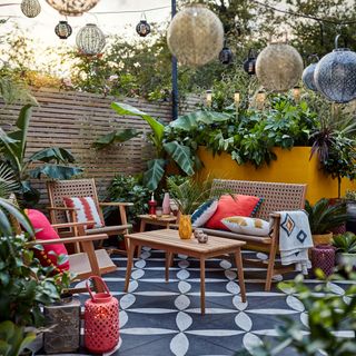 garden with a sitting area and wooden rail