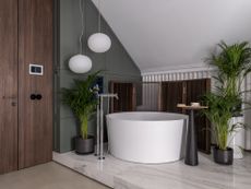 A bathroom with tall plants