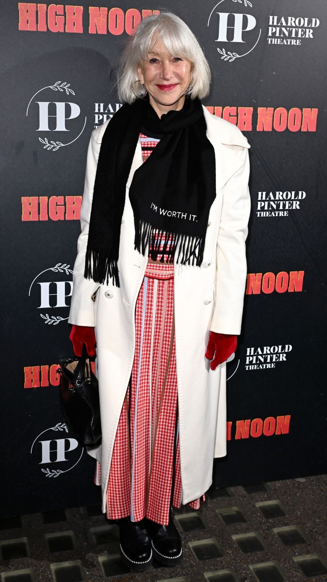 helen mirren wearing a red dress with biker boots