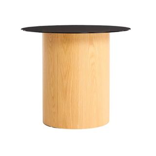 A wooden plinth side table