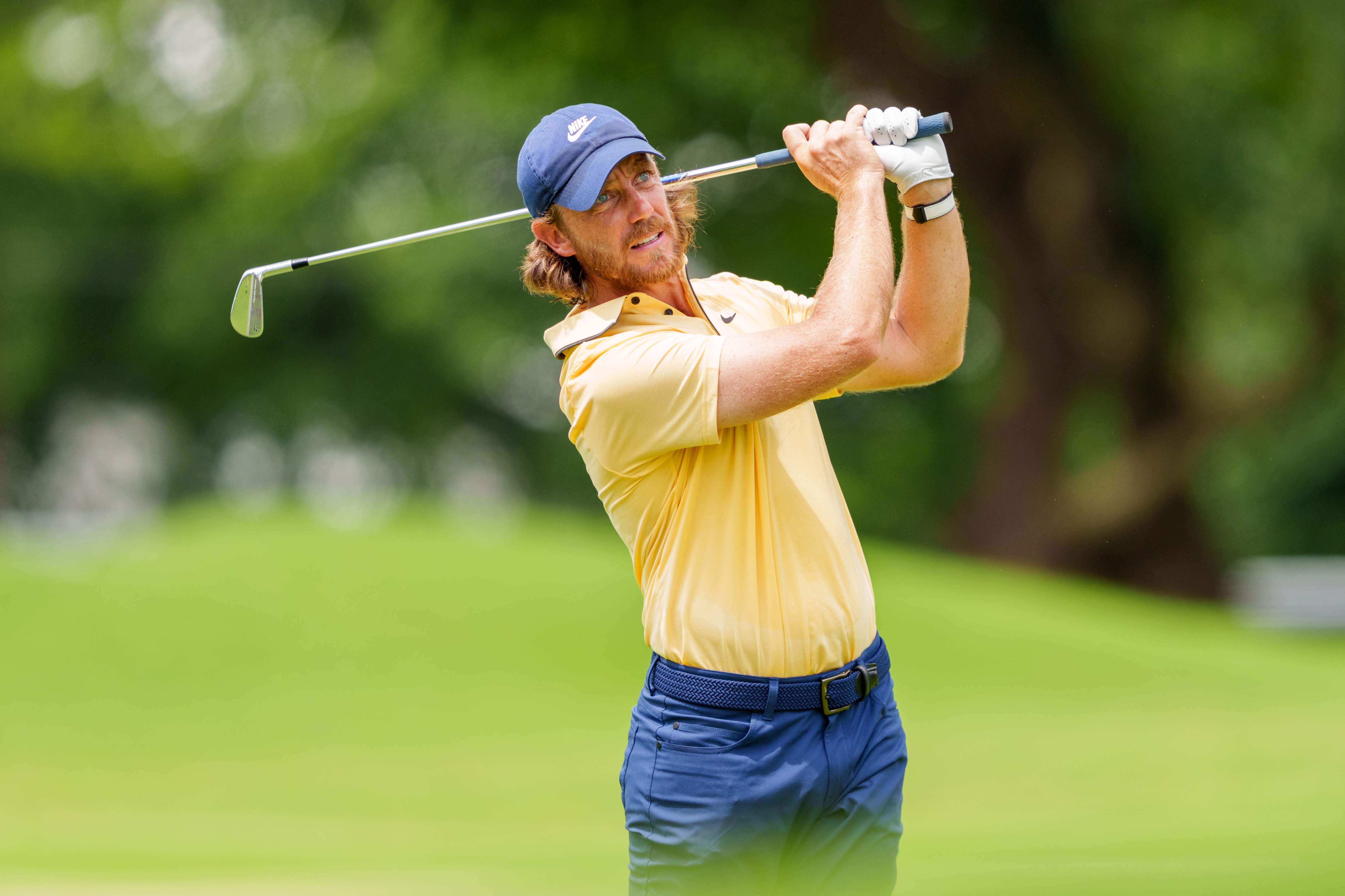 Tommy Fleetwood hits an approach shot