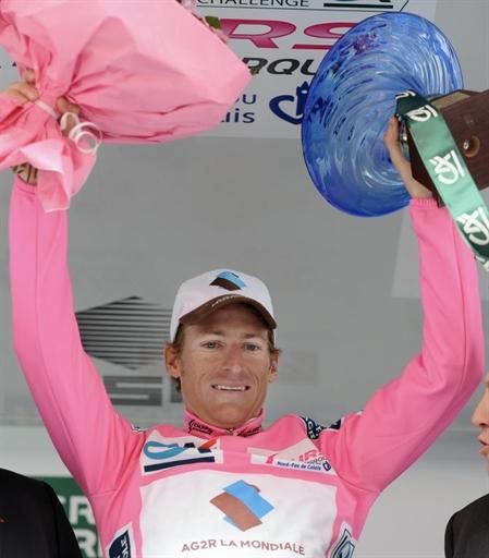 Martin Elmiger (Ag2R-La Mondiale) displays the spoils of his general classification win
