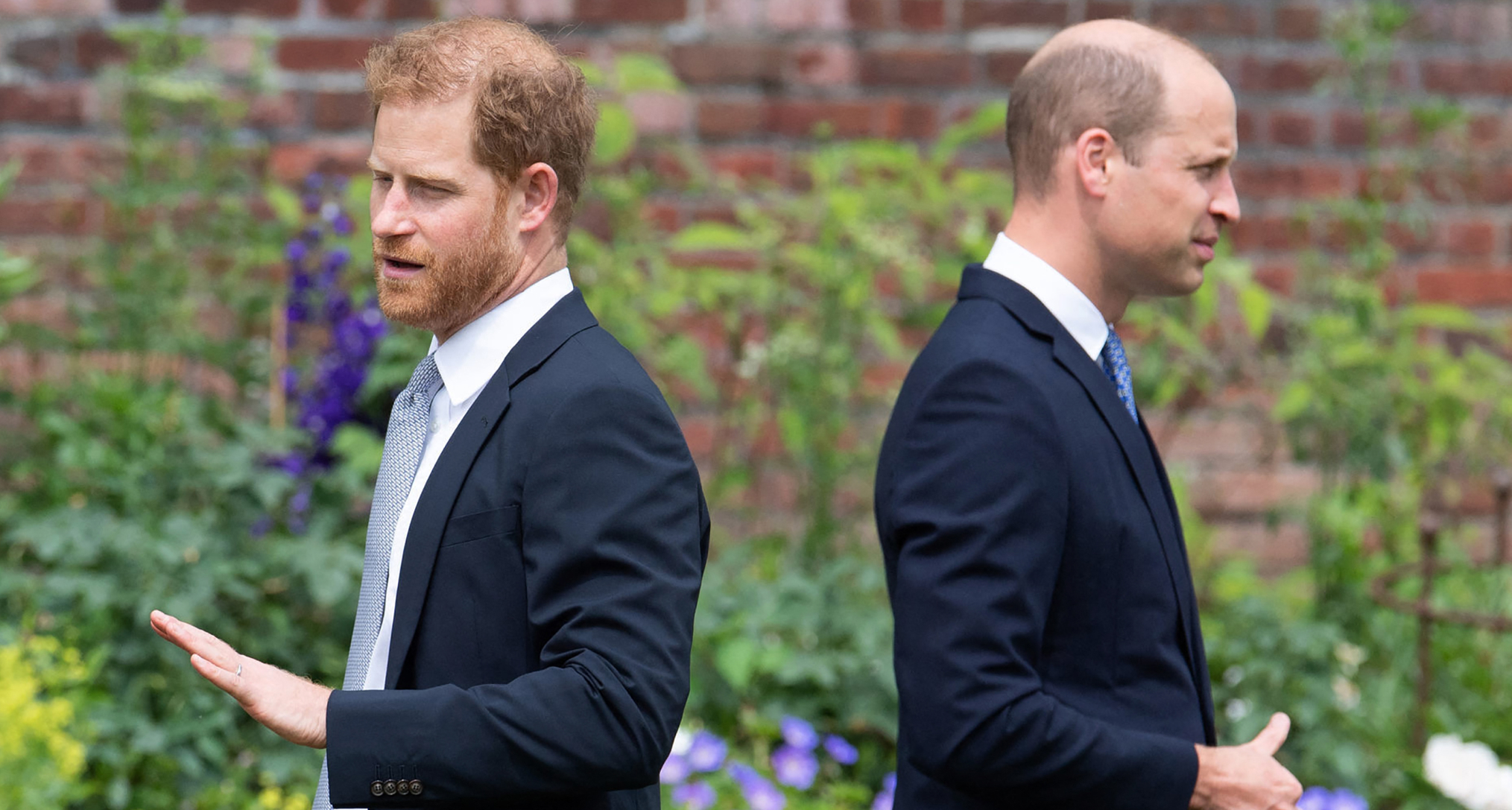 Prince William and Prince Harry standing back to back
