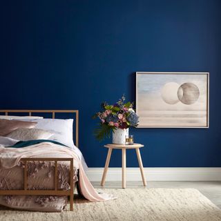 bedroom with valspar blue moon glow paint