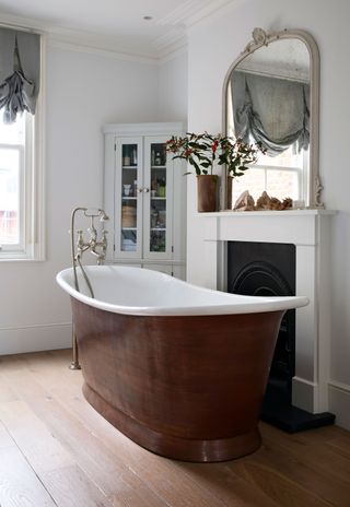 copper bath tub in an ensuite bathroom