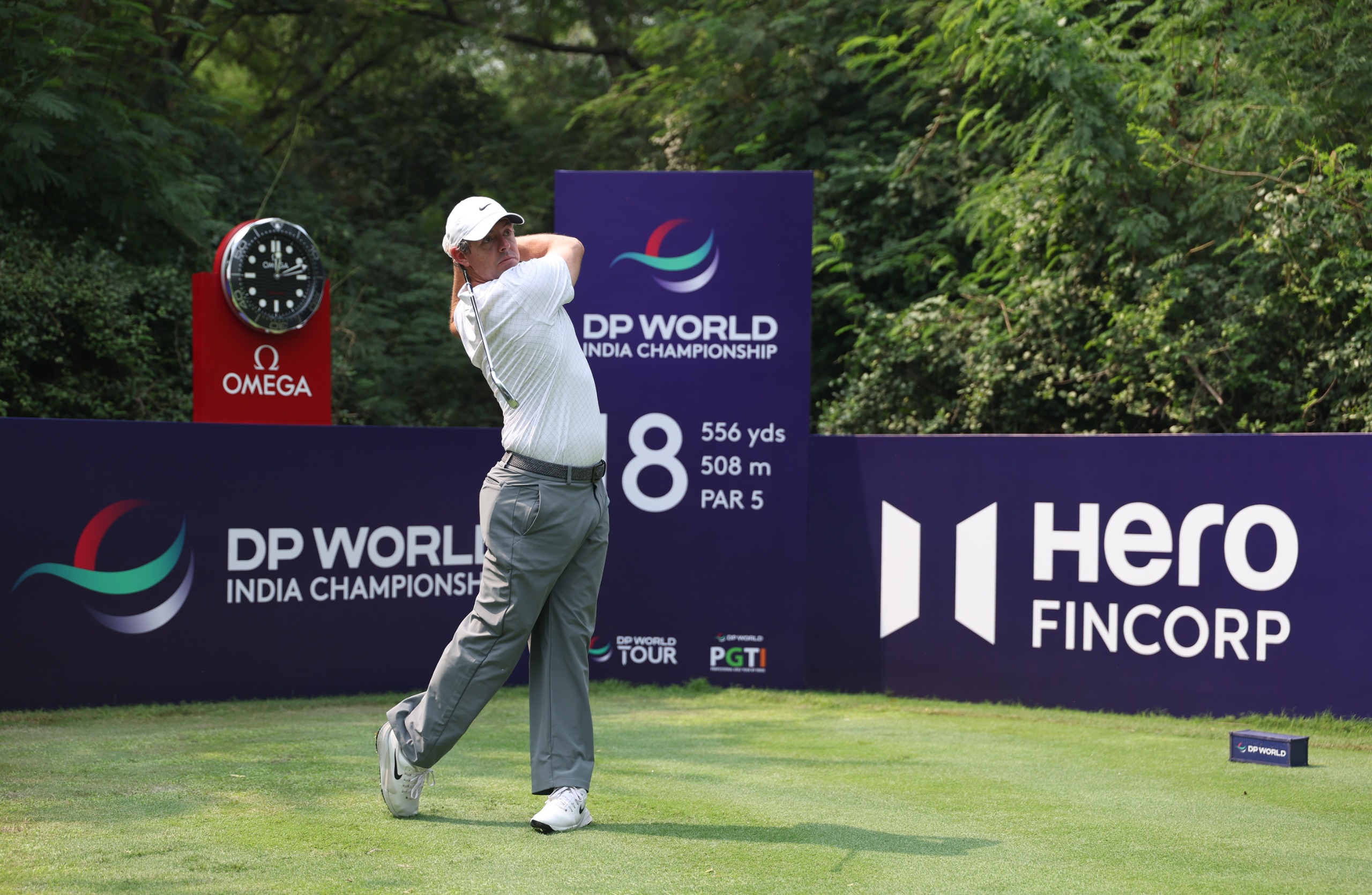 Rory McIlroy holds his finish on a tee shot at the DP World India Championship
