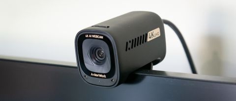 AnkerWork C310 webcam mounted on top of a monitor screen