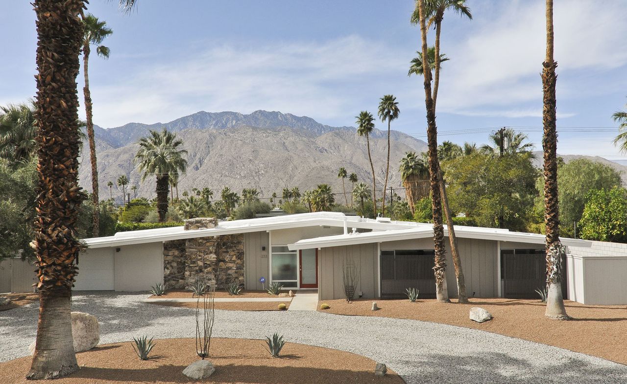 Image of house and palm trees