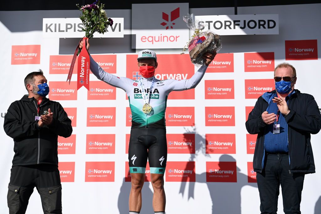 KILPISJARVI FINLAND AUGUST 06 Martin Laas of Estonia and Team Bora Hansgrohe celebrates at podium as at stage winner during the 8th Arctic Race Of Norway 2021 Stage 2 a 178km stage from Nordkjosbotn to Storfjord Kilpisjrvi Finland ArcticRace on August 06 2021 in Kilpisjarvi Finland Photo by Stuart FranklinGetty Images