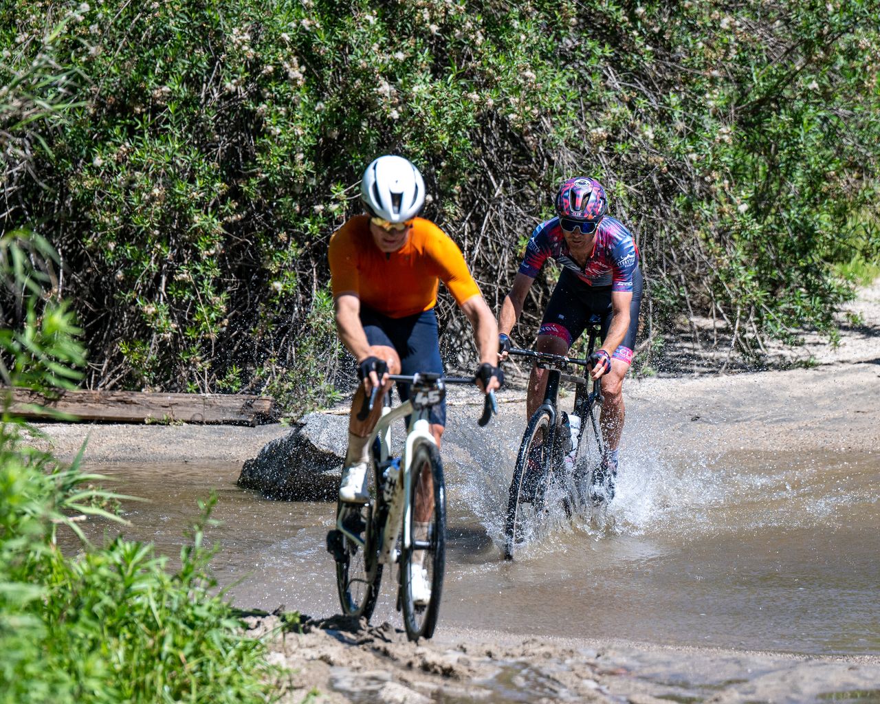 Lance Haidet (Specialized/SRAM/Velocio) leads Peter Stetina (Canyon) through water crossing
