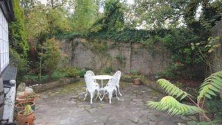 Garden designer Nic Howard used his creative skills to turn a compact courtyard into a haven bursting with colour and interest