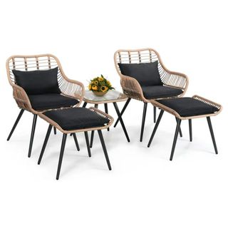 A Joivi 5 Piece Bistro Set - two wicker chairs, a table and two ottomans