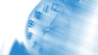 A distorted image of a blue clock with motion blur