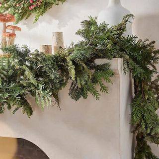 Fresh Juniper + Noble Fir Garland on a white mantel.