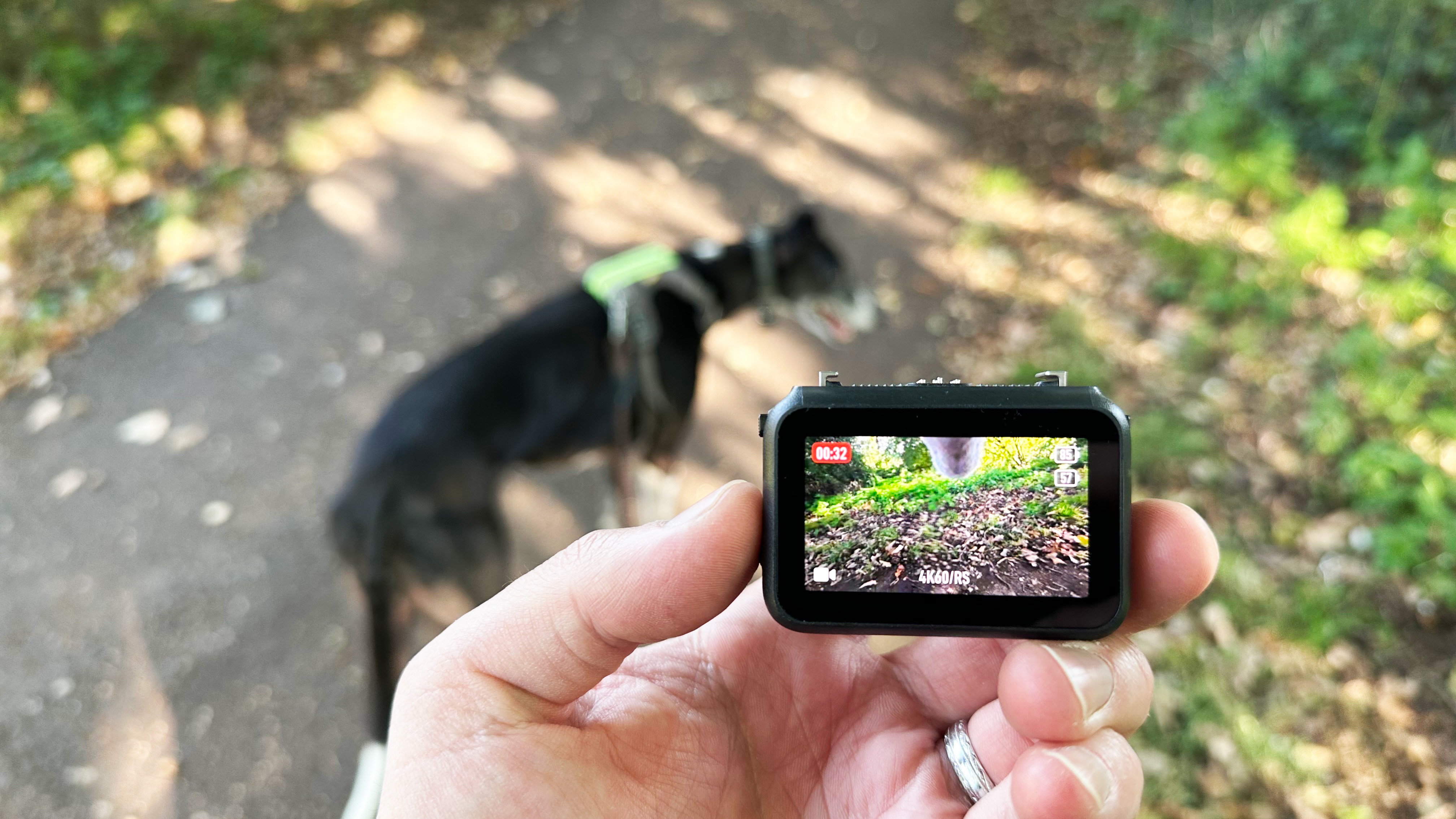 The DJI Osmo Nano display in hand being used as a remote control