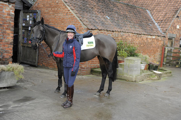 8-Nic-and-Annie-Clover-outside-entrance-to-the-converted-barn-where-19-horses-are-now-stabled.jpg