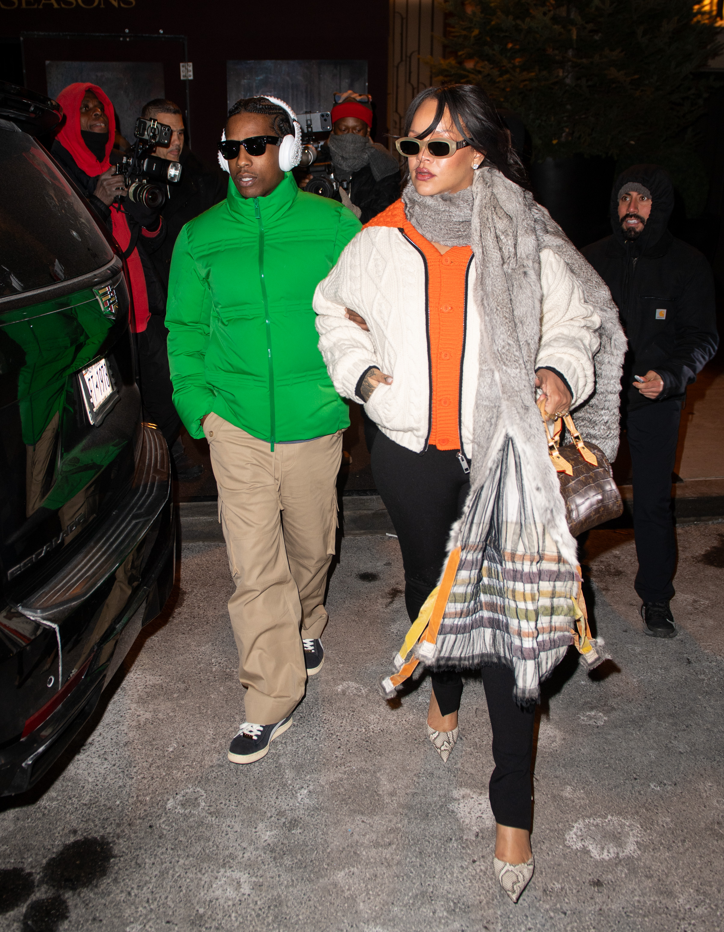 Rihanna was spotted with A$AP Rocky wearing an oversize cardigan with leggings and a Louis Vuitton bag