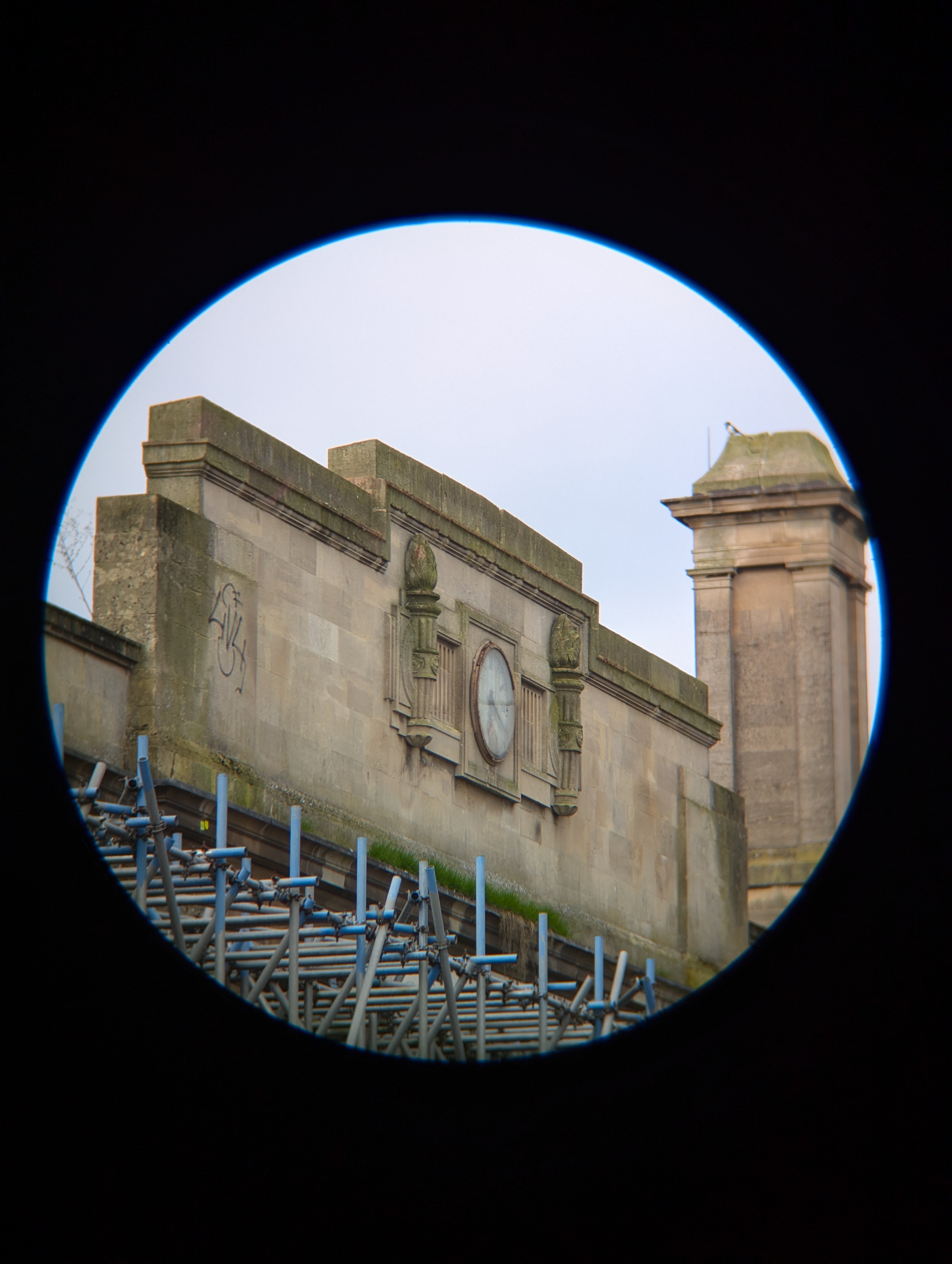 A photo of a big clock taken with an Apexel TM6 TeleMacro lens