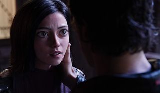 Alita: Battle Angel Hugo takes Alita's cheek in his hand