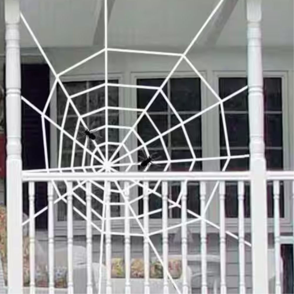 Large white spider web decoration hung in porch