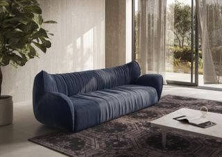 Blue 'Juno' sofa by Iosa Ghini for Natuzzi Italia in neutral toned living room