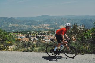 David Bradford riding with view over Lefkara in the background