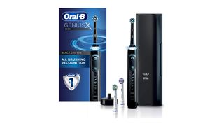 Image shows a black Oral-B Genius X along with accessories and its box.