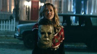 Judy Greer as Karen holding Michael mask in Halloween Kills