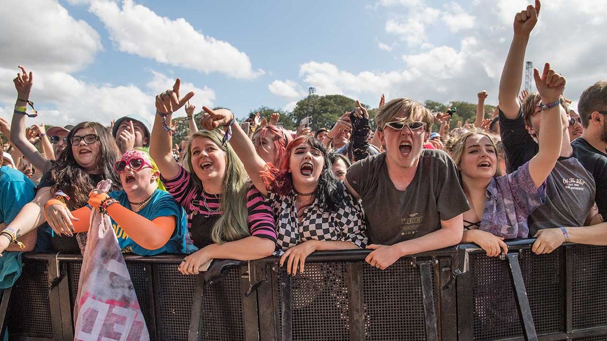 The crowd watch as Yungblud perform on stage during Leeds Festival 2019 at Bramham Park on August 23, 2019 in Leeds, England