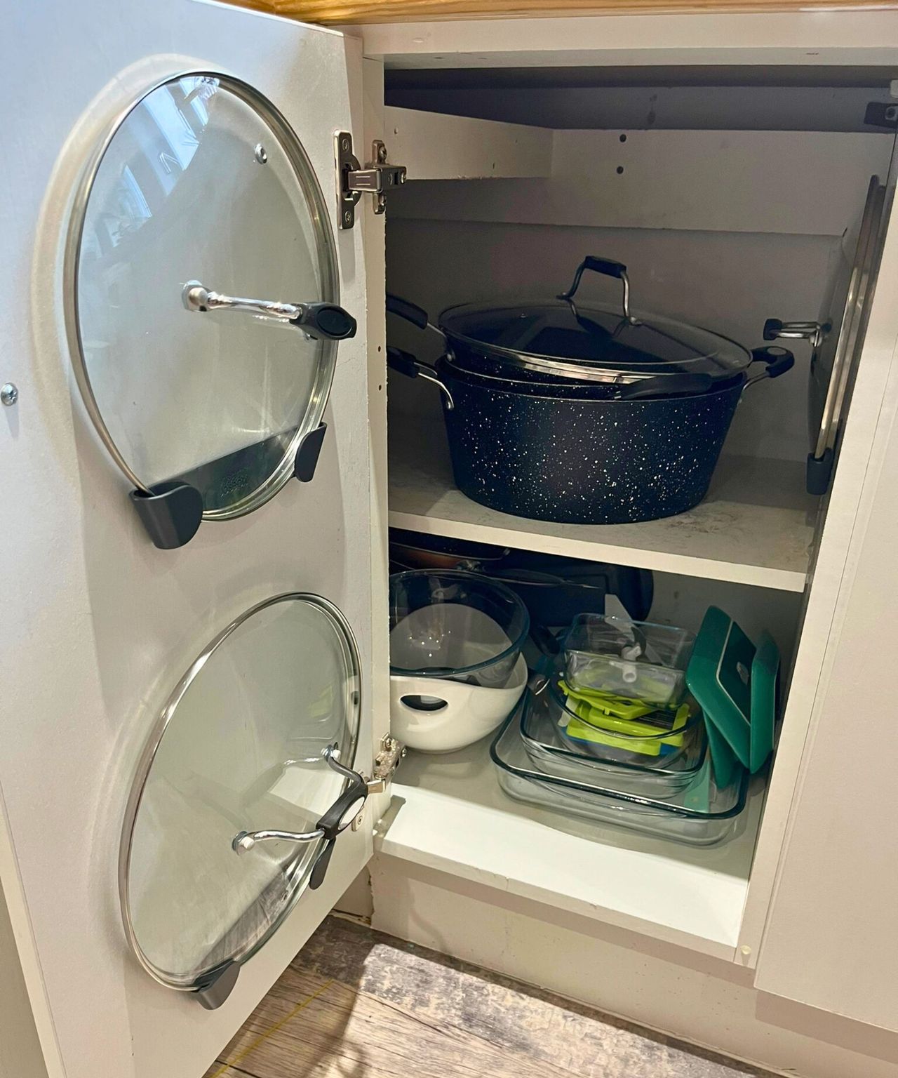 My pan lids on the inside of the cabinet door in the Joseph Joseph holder and another inset on the cabinet wall. The pots and pans are now stacked tidily on the top shelf and the lower area streamlined from my decluttering