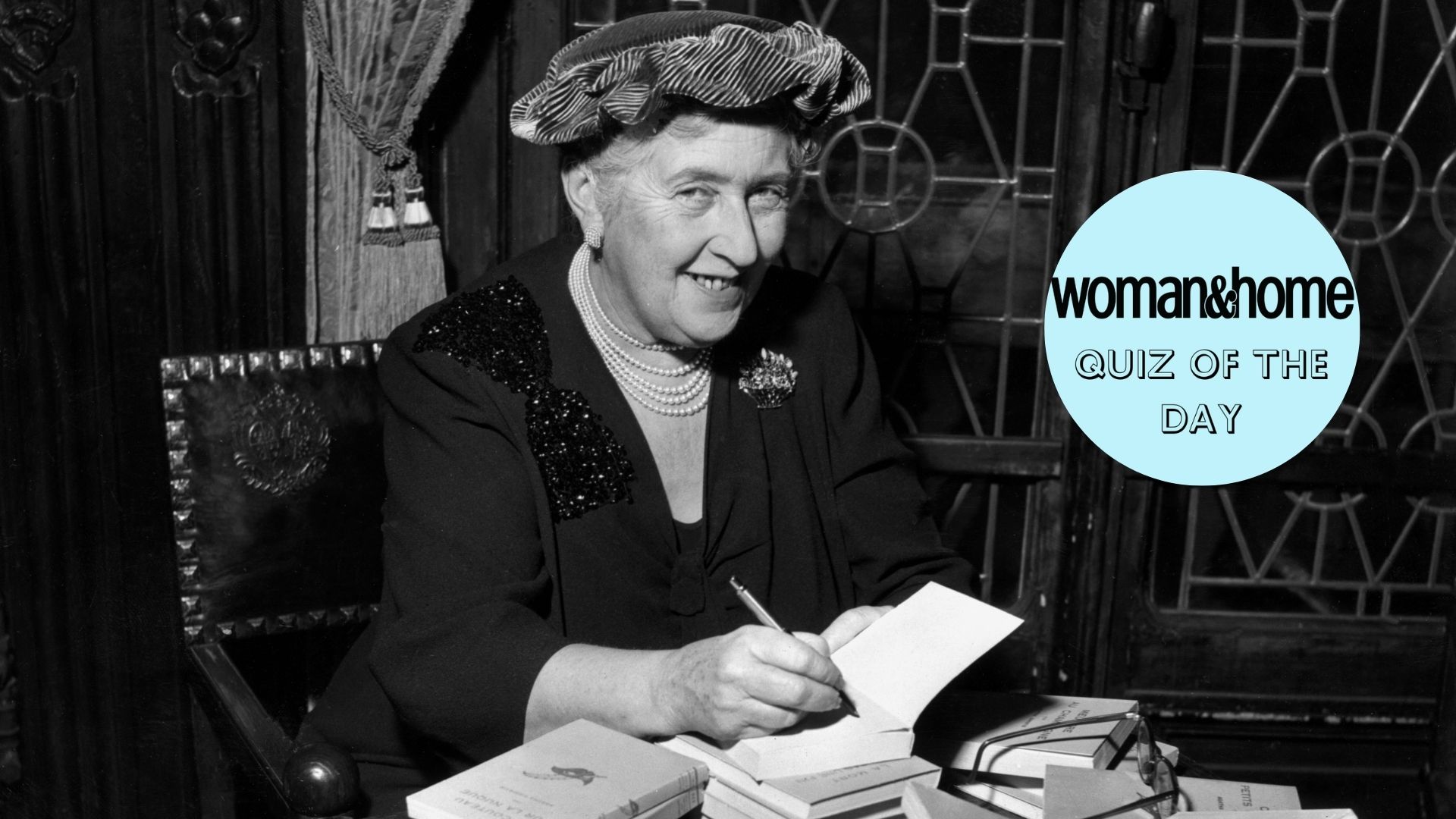 Agatha Christie signing copies of her books circa 1950