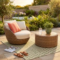 Beautiful garden furniture by Drew Barrymore at Walmart in a pretty garden