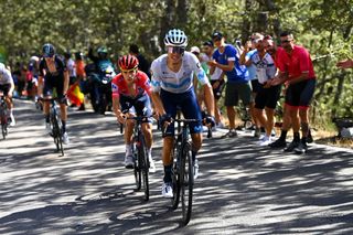 Enric Mas (Movistar) with race leader Remco Evenepoel (Soudal-QuickStep) behind on stage 20 of the 2022 Vuelta a España