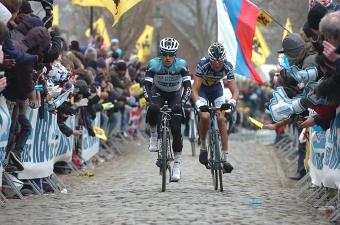 Michael Kwiatkowski (Omega Pharma-QuickStep) leads Mirko Selvaggi (Vacansoleil-DCM) over the cobbles.