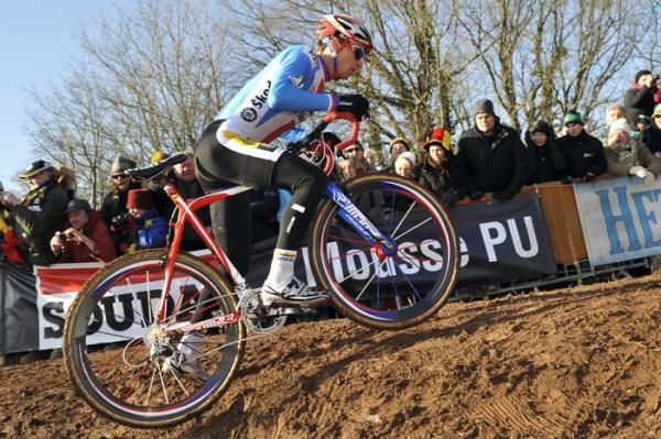 Power and a quick foot down gets Stybar over the tricky muddy ramp