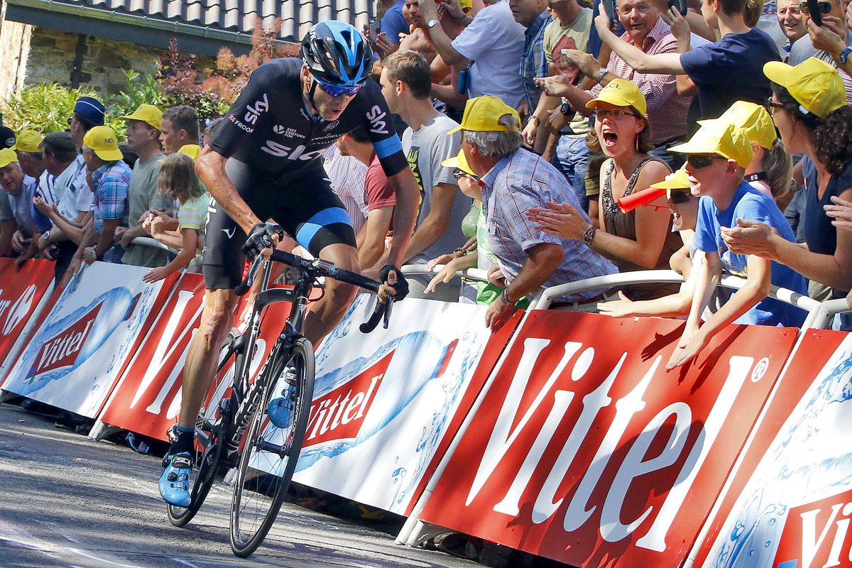 Chris Froome (Team Sky) surges out of the saddle in pursuit of Rodriguez