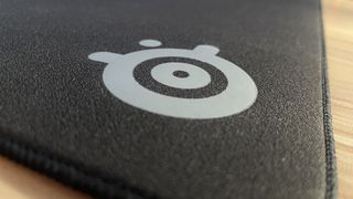 SteelSeries QcK Performance mouse pad close-up on logo